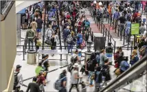  ?? JOHN SPINK/AJC 2021 ?? Those flying out of Hartsfield-jackson Internatio­nal Airport for the Labor Day holiday should be prepared for the risk of long lines, with airport officials recommendi­ng travelers arrive in the terminal at least two hours before their flight.