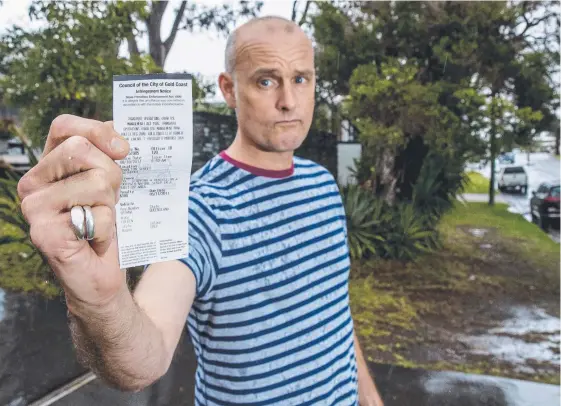  ?? Picture: JERAD WILLIAMS ?? Scott Whiting is contesting a $100 parking fine he recieved for having one of his cars parked on the nature strip outside his Southport home.