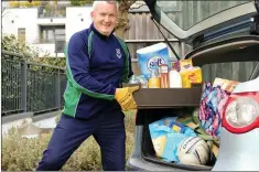  ??  ?? John McCarthy of Bray Emmets taking a box of shopping from his car boot