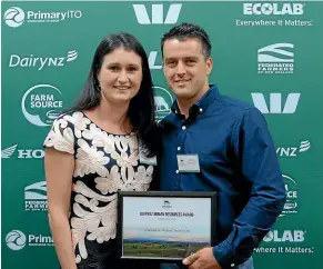  ??  ?? Sarah and Aidan Stevenson picking up the top prize for sharemilki­ng at the Waikato Dairy Industry Awards earlier this month.