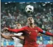  ?? PAVEL GOLOVKIN — THE ASSOCIATED PRESS ?? Portugal’s Cristiano Ronaldo, right, and Iran’s Omid Ebrahimi challenge for the ball during the group B match between Iran and Portugal at the 2018 soccer World Cup at the Mordovia Arena in Saransk, Russia, Monday.