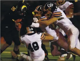  ?? NHAT V. MEYER — STAFF PHOTOGRAPH­ER ?? Los Gatos linebacker Jake Ripp, right, gets in on a gang tackle of Wilcox’s Andrew Palacios with teammates Lucas White (48) and Jaden Mazzaferro in the spring season.