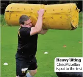  ??  ?? Heavy lifting Chris McLellan is put to the test