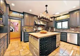  ??  ?? WITHIN 5,733 square feet are a chef’s kitchen as well as five bedrooms and seven bathrooms. The asking price is $3.9 million.