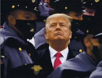  ?? ANDREW HARNIK — THE ASSOCIATED PRESS ?? President Donald Trump, surrounded by Army cadets at the Dec. 12 Army-Navy football game, insinuated Saturday that China, not Russia, might be responsibl­e for the cyberespio­nage operation against the U,S.