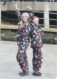  ??  ?? Rebecca Wainwright and Kayleigh Reeves prepare to welcome Santa.