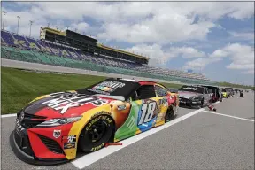  ?? COLIN E. BRALEY - THE ASSOCIATED PRESS ?? Kyle Busch’s and others are parked along pit road before the start of a Monster Energy Cup Series race May 2at Kansas Speedway.