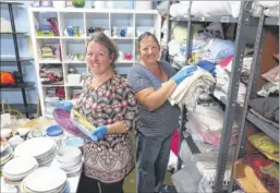  ??  ?? Necessary Furniture volunteers Louise Houston and Yvonne Sancto