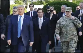  ?? PATRICK SEMANSKY — THE ASSOCIATED PRESS ?? President Donald Trump departs the White House to visit outside St. John’s Church, in Washington on June 1with Attorney General William Barr, Secretary of Defense Mark Esper and Gen. Mark Milley, chairman of the Joint Chiefs of Staff.