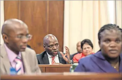  ?? Photo: David Harrison ?? Undeterred by the law: Communicat­ions Minister Faith Muthambi (right), acting on the advice of the SABC board, ignored court rulings and appointed Hlaudi Motsoeneng (centre) to a key post.