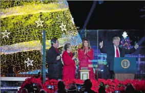  ?? KATHERINE FREY/ WASHINGTON POST ?? President Donald Trump and first lady Melania Trump kick off the 95th annual National Christmas Tree Lighting with Dean Cain, left, and Kathie Lee Gifford on Thursday evening in Washington, D.C.