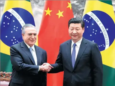  ?? WU ZHIYI / CHINA DAILY ?? President Xi Jinping meets with his Brazilian counterpar­t, Michel Temer, at the Great Hall of the People in Beijing on Friday.