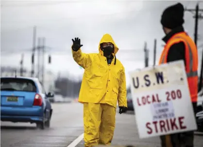  ?? Photograph: Dan Busey/AP ?? Union workers picket in Muscle Shoals, Alabama. ‘The struggle against fascism does not begin or end with fighting fascists in the street.’