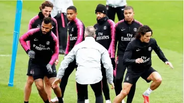  ??  ?? (From right) Edinson Cavani, Kylian Mbappe with Neymar and team mates during training. — Reuters photo