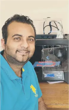  ??  ?? Ashan Dharamsi with his 3D printers