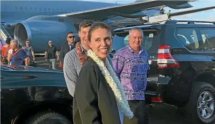  ?? PHOTO: HENRY COOKE/STUFF ?? Prime Minister Jacinda Ardern touches down in Samoa at the start of the Government’s Pacific mission. Behind her is partner Clarke Gayford.