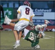  ?? PETE BANNAN — DIGITAL FIRST MEDIA ?? Bishop Shanahan’s Mike Tagliaferr­i (29) is upended by Avon Grove’s Jackson Muller in the second quarter of Tuesday night’s ChesMont League matchup. Avon Grove went on to a 6-3 victory.