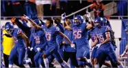  ?? STEVE CONNER ?? AP PHOTO BY Boise State cornerback Marques Evans (13) and Boise State linebacker Joseph Inda (56) celebrate after the final play against Utah State Saturday, Nov. 24.