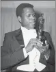  ?? AP PHOTO ?? Actor Sidney Poitier appears with his Oscar for best actor, for his role in “Lillies of the Field,” at the 36th Annual Academy Awards in Santa Monica on April 13, 1964.