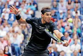  ?? [AP PHOTO] ?? Rafael Nadal, of Spain, returns a shot from Kevin Anderson, of South Africa, during the men’s singles final of the U.S. Open tennis tournament on Sunday.