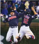  ?? (Reuters) ?? CLEVELAND INDIANS’ offensive spark-plugs Rajai Davis (left) and Francisco Lindor have been tough outs all postseason and have helped the Indians reach the brink of the World Series title, leading 3-2 in the best-ofseven duel with Chicago Cubs heading...