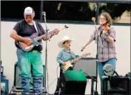  ??  ?? Braxton Blankenshi­p (center), 2016 Lincoln Riding Club Lil’ Mister, joined Howard Lester and the Boston Mountain Playboys on stage to provide a soundtrack for the street dance held from 8 p.m. to 11 p.m. on the Lincoln Square in 2017. Band members shown with Braxton are Chris Lynch (left) bass/vocals and Stacy Pixley (fiddle). Braxton has played with the band in past years during the Siloam Springs Rodeo street dance and at other street dances.