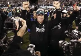  ?? PATRICK SEMANSKY, THE ASSOCIATED PRESS ?? Philadelph­ia Eagles coach Doug Pederson celebrates after winning the NFC title game against the Minnesota Vikings on Sunday. The Eagles won 38-7 to advance to Super Bowl LII.