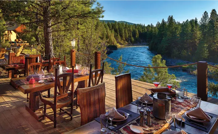  ??  ?? The dining pavilion at the resort’s Cliffside Camp overlooks the confluence of the Blackfoot River and Elk Creek.