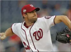  ?? AP PHOTO/ CAROLYN KASTER ?? Washington Nationals starting pitcher Max Scherzer throws during the first inning of the team’s baseball game against the Baltimore Orioles at Nationals Park on Thursday in Washington.