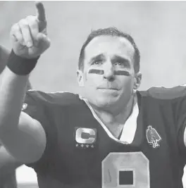  ?? BRYNN ANDERSON/AP ?? Saints quarterbac­k Drew Brees gestures to his family and fans after an NFL divisional round playoff game against the Buccaneers on Jan. 17 in New Orleans.