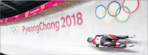  ?? THE CANADIAN PRESS/NATHAN DENETTE ?? Kimberley McRae of Canada competes in heat two of women’s single luge during the 2018 Olympic Winter Games in Pyeongchan­g, South Korea on Monday.