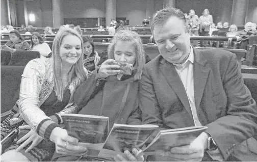  ?? Yi-Chin Lee / Houston Chronicle ?? Rockets GM Daryl Morey joins his daughter Karen, center, and Karen’s friend, Sydney Holt, both 17, to watch “Into the Woods” at the Hobby Center.