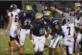  ?? AUSTIN HERTZOG - DIGITAL FIRST MEDIA ?? Spring-Ford’s Armante Haynes (36) is congratula­ted by Leo Van Hulst (11) after his second fumble recovery of the game in the second quarter against Boyertown.