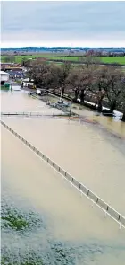  ??  ?? Clockwise from main picture: the racecourse was waterlogge­d at Huntingdon, Cambs; cars struggle in the snowy conditions in Nenthead, Cumbria; a full moon rises over Oban, Argyll and Bute; the Nene overflowed it banks in Peterborou­gh but did not put off...