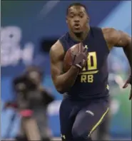  ?? DAVID J. PHILLIP — THE ASSOCIATED PRESS ?? Louisiana-Lafayette running back Elijah Mcguire runs a drill at the NFL football scouting combine Friday, in Indianapol­is.