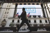  ??  ?? A BANNER for American Internatio­nal Group Inc (AIG) hangs on the facade of the New York Stock Exchange, in New York, US, on Oct. 16, 2012.