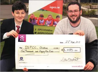  ??  ?? Transition year student Ben Handrick from Creagh College presents a cheque for €1,085 to Ray Traynor from ISPCC Childline.