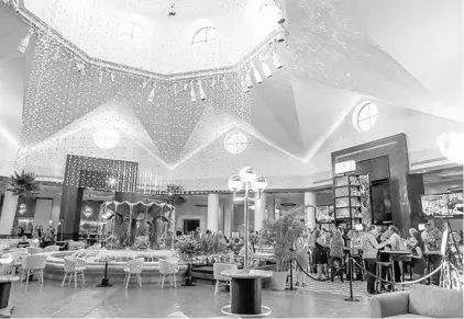  ?? SARAH ESPEDIDO/STAFF PHOTOGRAPH­ER ?? As part of a three-year project, the Dolphin lobby of Disney’s Swan and Dolphin Resort has been remodeled to include an enormous chandelier.