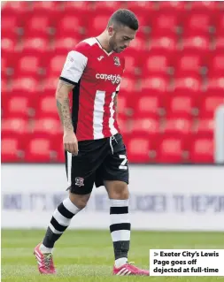  ??  ?? > Exeter City’s Lewis Page goes off dejected at full-time