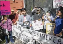  ?? RICARDO B. BRAZZIELL / AMERICAN-STATESMAN ?? Austin City Council Member Greg Casar speaks as the residents of a North Lamar mobile home park protest an investors’ “boot camp” at the Westin Austin downtown on Friday.