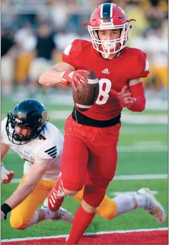  ?? NWA Democrat-Gazette/ANDY SHUPE ?? Farmington receiver Drew Sturgeon (right) catches a pass in the end zone Friday ahead of Prairie Grove safety Caden Redfern during the first half of play at Cardinal Stadium in Farmington. Visit nwadg.com/photos to see more photograph­s from the game.