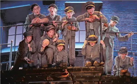  ?? PHOTO BY DIANE SOBOLEWSKI ?? Young actors playing orphans in “Oliver!” sing “Food, Glorious Food.”