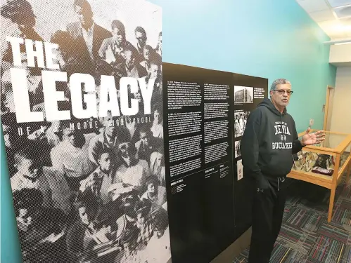  ?? Rod Aydelotte/Waco Tribune Herald via AP ?? ■ Central Texas African American Heritage Foundation president Don Wright talks about “The Legacy Of A.J. Moore High School,” which showcases an important part of Waco history, on Nov. 21. The glass-topped display and a large wall panel touches on all of the above elements in telling the story of Waco’s black high school, which educated more than 4,000 students over nearly a century before closing its doors in 1971.