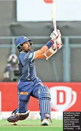  ?? — IPL ?? Wriddhiman Saha of Gujarat Titans plays a shot against Chennai Super Kings during their IPL match in Mumbai on Sunday.