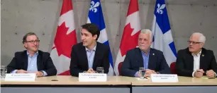  ?? — AP ?? Justin Trudeau at a meeting with members of the aluminium industry in Saguenay on Monday.