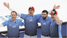  ?? Aaron Favila / Associated Press ?? John Shuster of the United States delivers a stone against Sweden during the men’s curling gold-medal match. John Landsteine­r and Matt Hamilton sweep to keep the stone on track. Tyler George (left), Shuster, Landsteine­r and Hamilton wave to the...