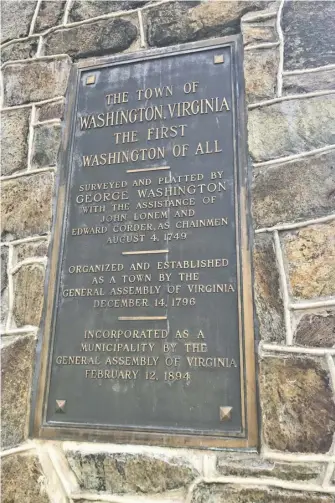  ?? BY JOHN MCCASLIN ?? The monument to George Washington on Jett Street, stating as fact that the town was surveyed in 1749 by the nation's future first president.