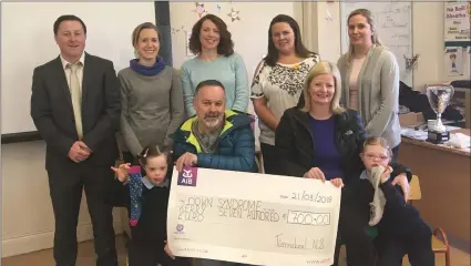  ?? Back row, ?? At the odd socks fundraiser cheque presentati­on were Jessica Treyvaud and her dad, Mark, and Niamh Foley and her mum, Brenda, with, staff members Conor Gleeson, principal, Kelly Mannix, Fiona Cronin, Kate Murphy and Anne Marie O’Sullivan.