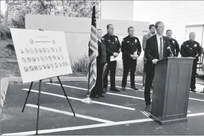  ?? AP PHOTO/AMY TAXIN ?? Brian Gilhooly, FBI special agent in charge, speaks about a sweeping racketeeri­ng case against the Mexican Mafia during a news conference in Orange, Calif., on Wednesday.