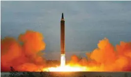  ?? AP/PTI ?? The North Korean government shows what was said to be the test launch of a Hwasong-12 intermedia­te range missile in Pyongyang in North Korea